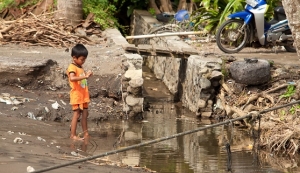 boy in dirty water